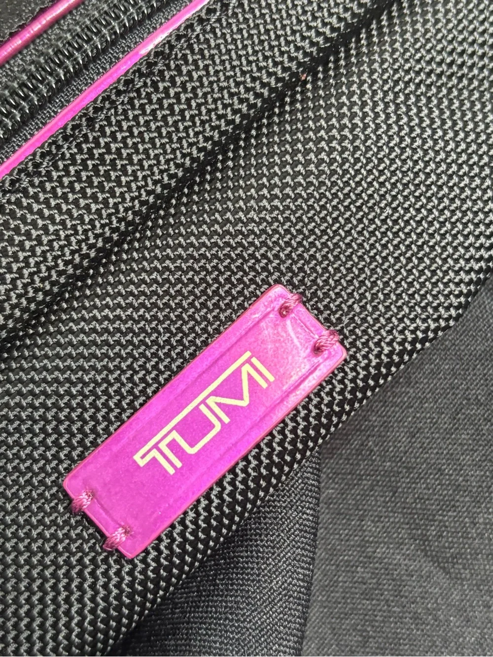 Tumi Black Travel Pouch with Pink Accents